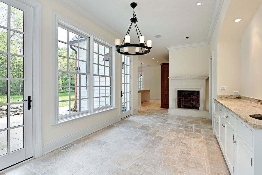 Large-format stone tile floor, the kind of work Precision Tile installs